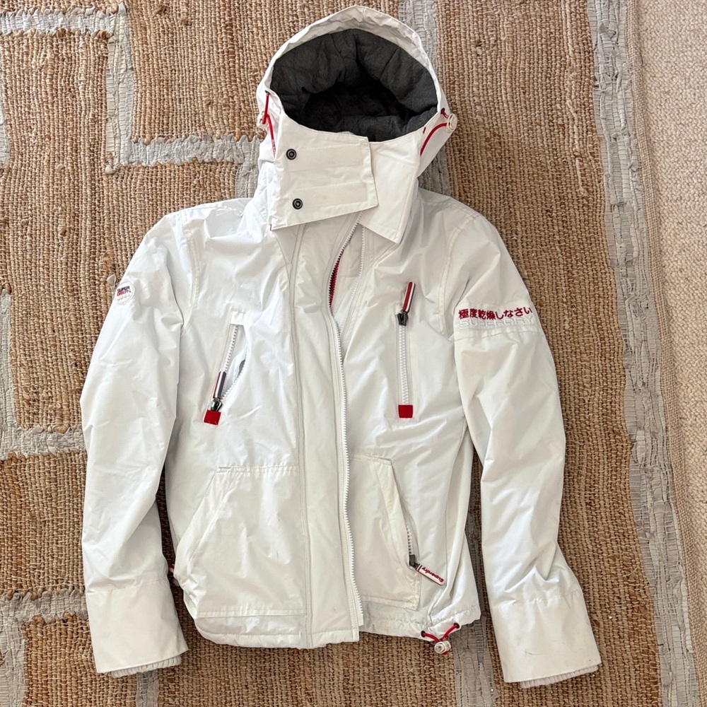 White Hooded Superdry Jacket with Red Accents